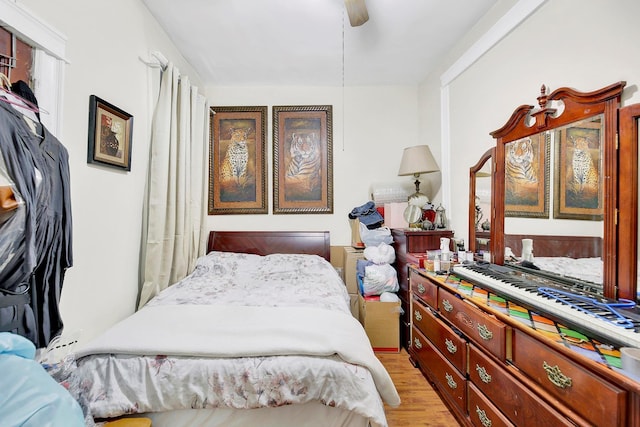 bedroom featuring ceiling fan and light hardwood / wood-style floors