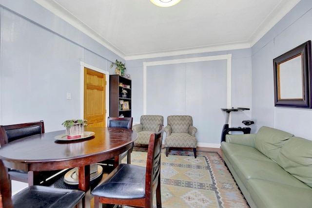 dining area with crown molding