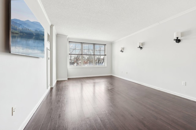 empty room featuring dark hardwood / wood-style flooring, a textured ceiling, and ornamental molding