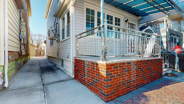 view of side of home with a porch