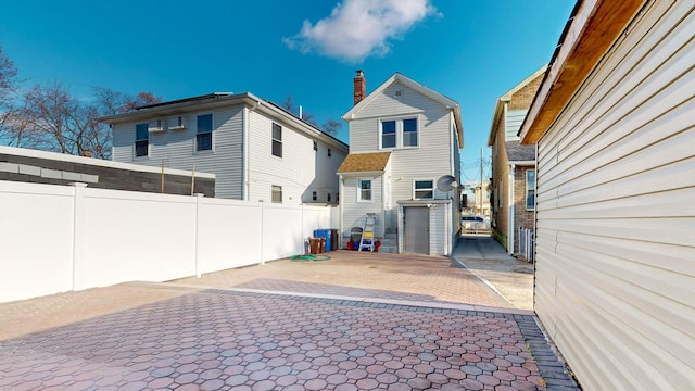 rear view of property with a patio area