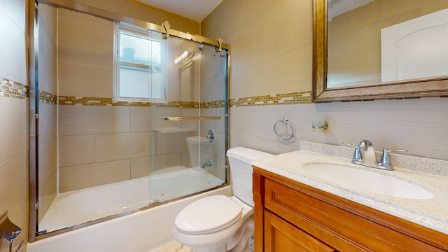 full bathroom with tasteful backsplash, enclosed tub / shower combo, toilet, vanity, and tile walls