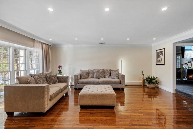 living room with dark wood-type flooring and ornamental molding