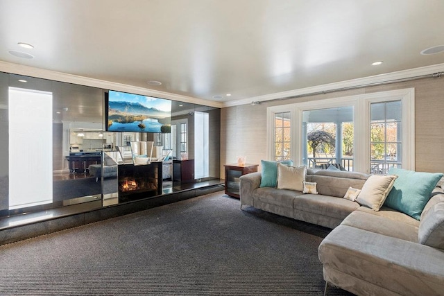 carpeted living room with a fireplace and ornamental molding