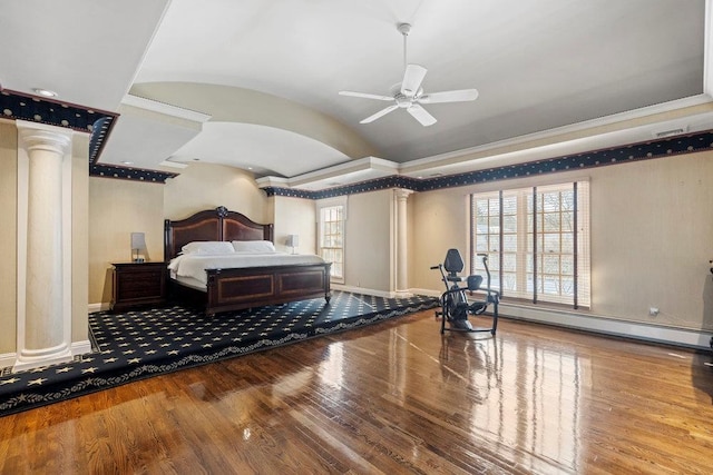 bedroom featuring hardwood / wood-style floors, ceiling fan, baseboard heating, and decorative columns