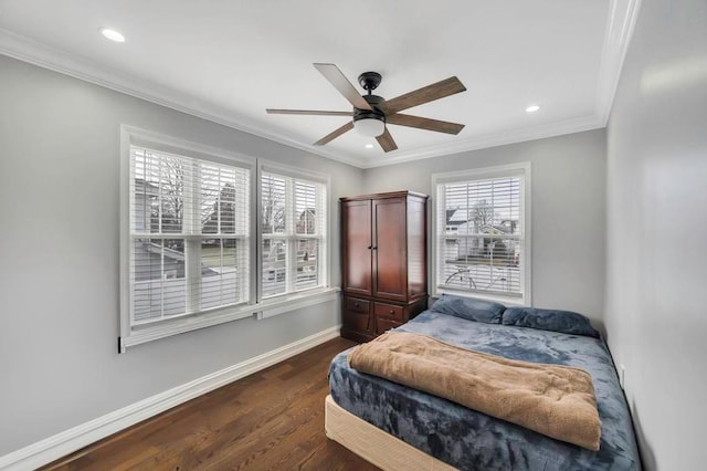 bedroom featuring ceiling fan, dark hardwood / wood-style flooring, and ornamental molding