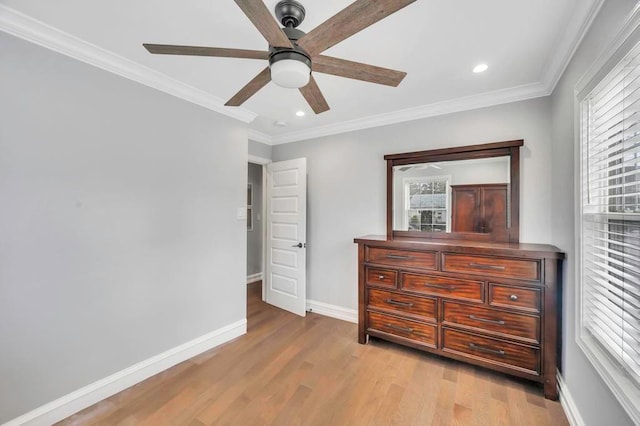 bedroom featuring ceiling fan, light hardwood / wood-style flooring, and ornamental molding