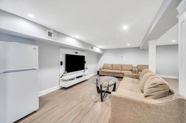 living room with light hardwood / wood-style floors