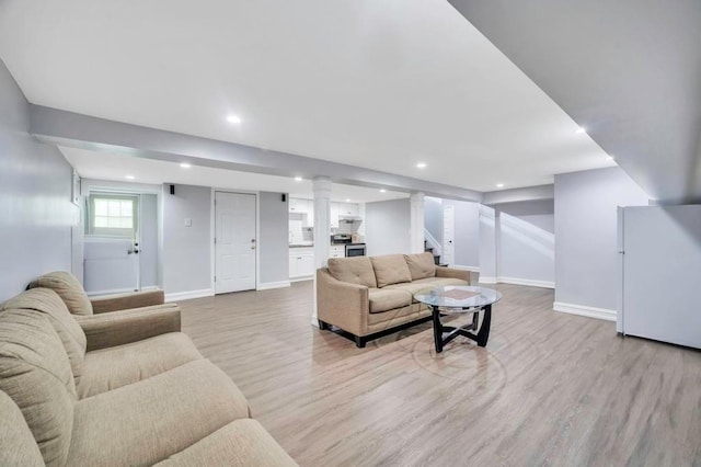 living room with light hardwood / wood-style floors