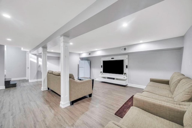 living room with light hardwood / wood-style floors