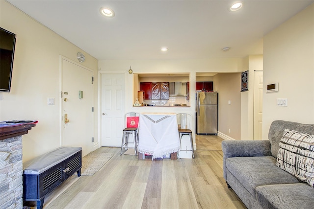 living room with light hardwood / wood-style flooring