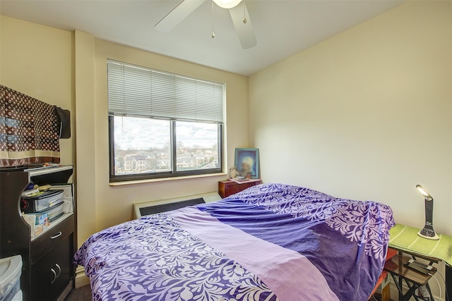 bedroom featuring radiator and ceiling fan