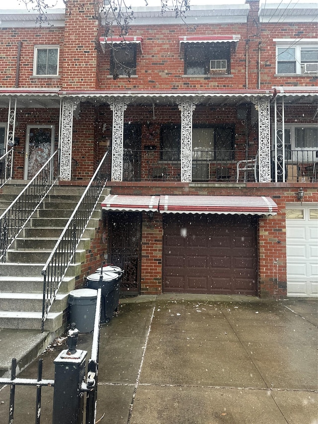 back of house featuring a garage