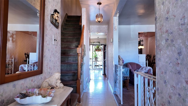 hall with wallpapered walls and stairway
