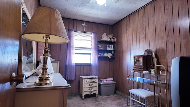 office space featuring carpet and wood walls