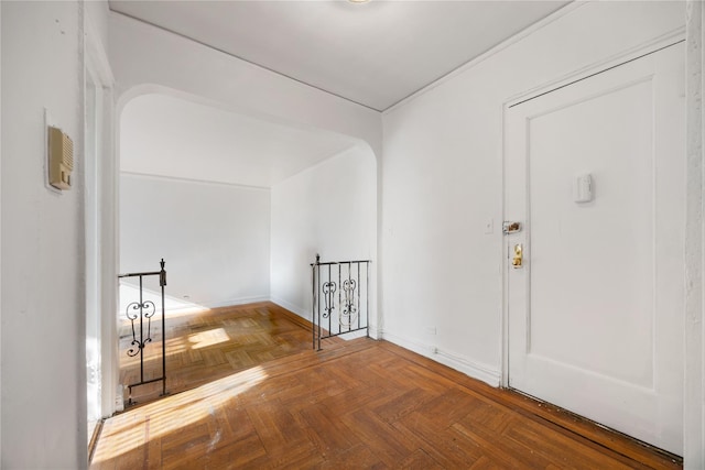 entryway featuring parquet flooring