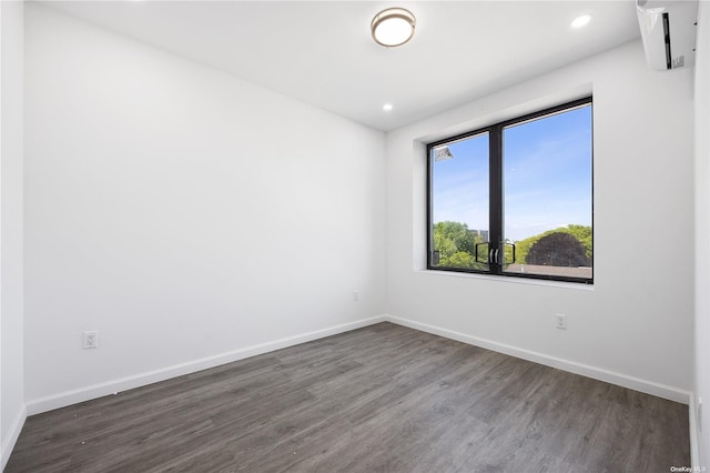 spare room featuring dark hardwood / wood-style flooring