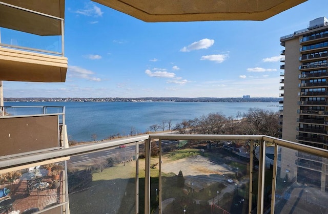 balcony featuring a water view