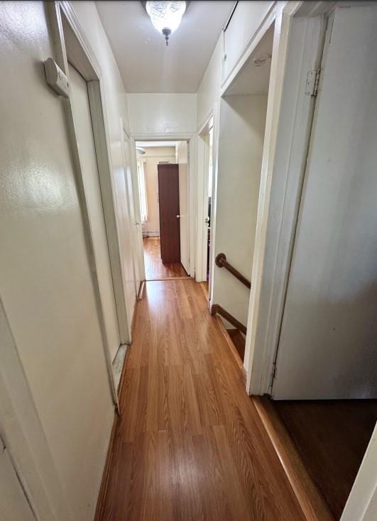 corridor featuring light hardwood / wood-style floors