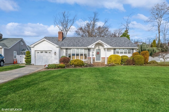 ranch-style house featuring a front yard and a garage