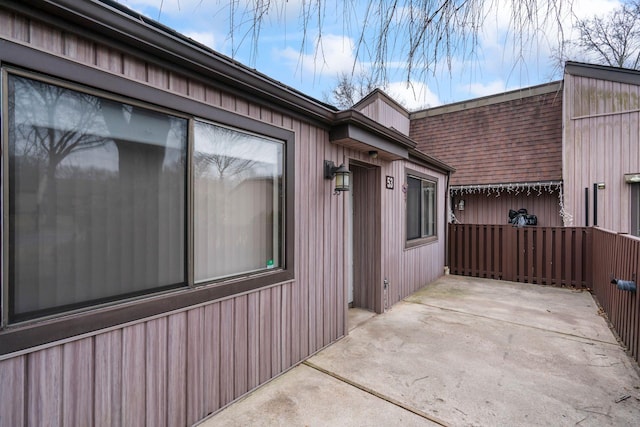 view of side of property featuring a patio area