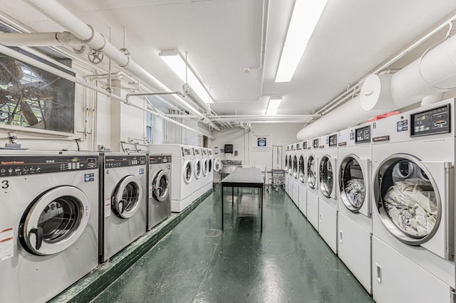 laundry area with washing machine and clothes dryer