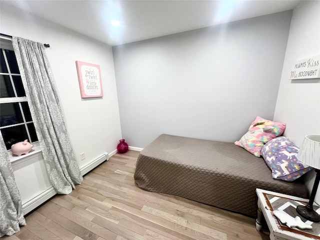 bedroom with light hardwood / wood-style flooring