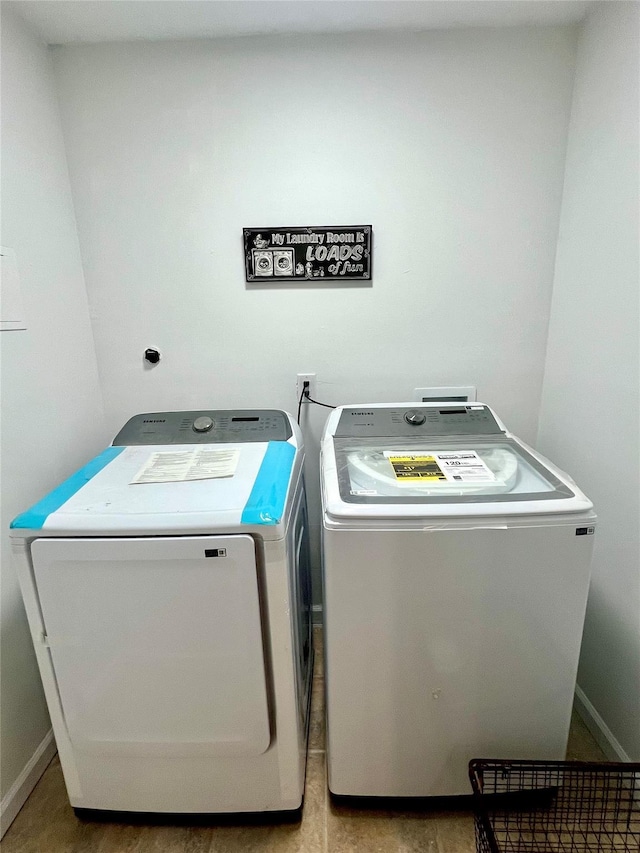 laundry room featuring washer and clothes dryer