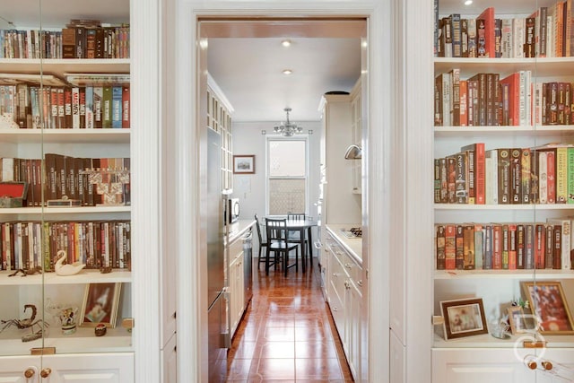 hall with tile patterned flooring