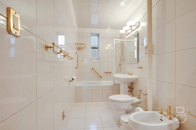 bathroom with tile patterned flooring, a bidet, toilet, tile walls, and tiled shower / bath