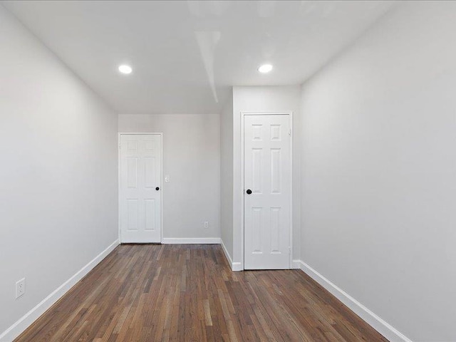 empty room featuring dark wood-type flooring