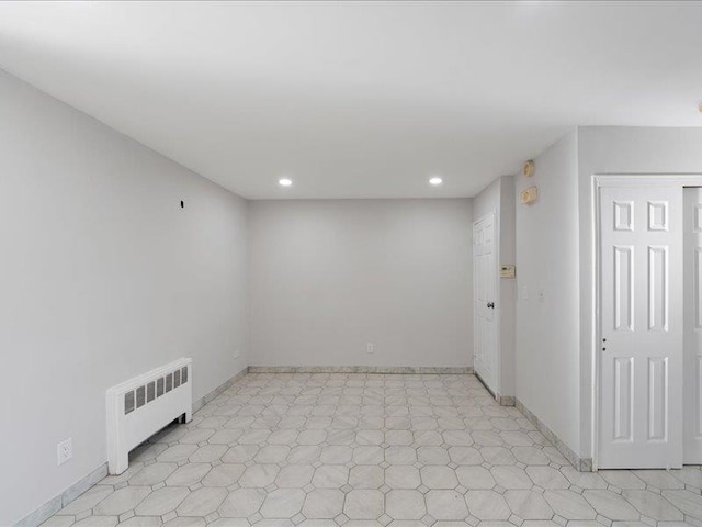 unfurnished room with radiator