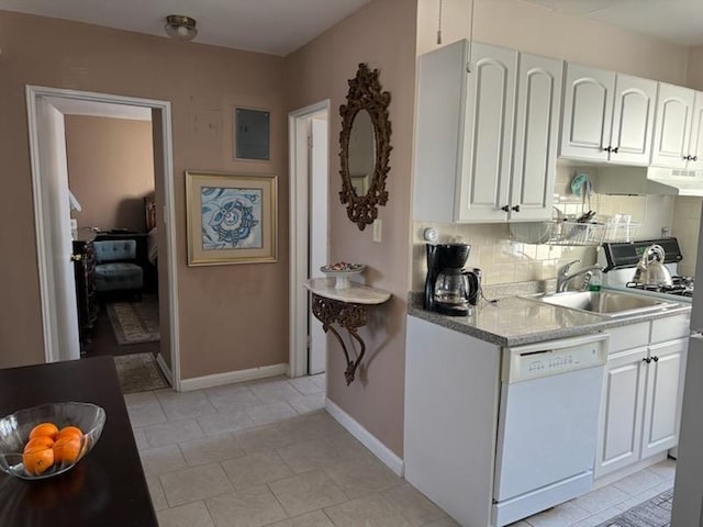 kitchen featuring sink, dishwasher, white cabinetry, backsplash, and light stone countertops