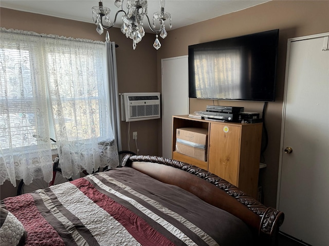 71-04 Little Neck Pkwy Unit 134A, Bellerose, NY 11426 - bedroom featuring a chandelier and a wall unit AC