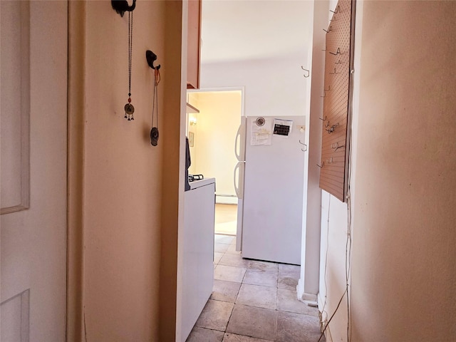 corridor with light tile patterned floors