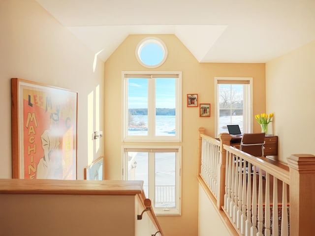 stairway featuring lofted ceiling