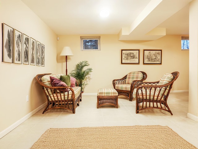 living area with tile patterned flooring and baseboards