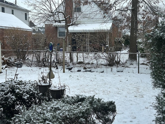 view of yard layered in snow