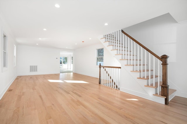 unfurnished living room with light wood-type flooring