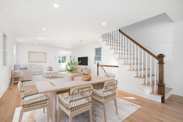 dining area with light hardwood / wood-style flooring