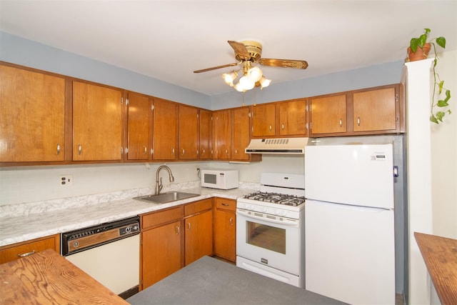 kitchen with wood counters, ceiling fan, sink, and white appliances