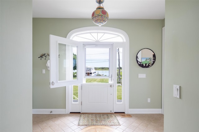 tiled entrance foyer featuring a wealth of natural light