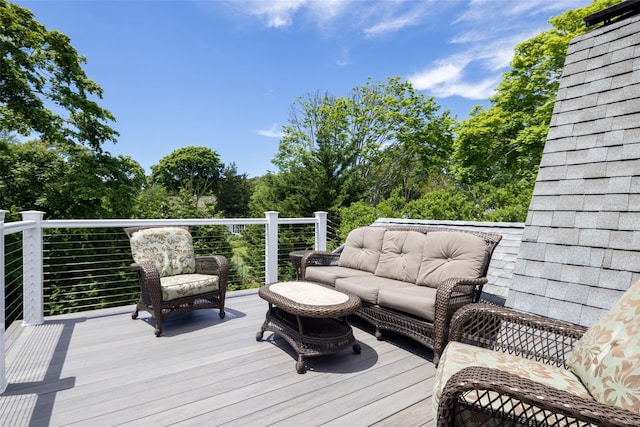 wooden deck featuring an outdoor hangout area