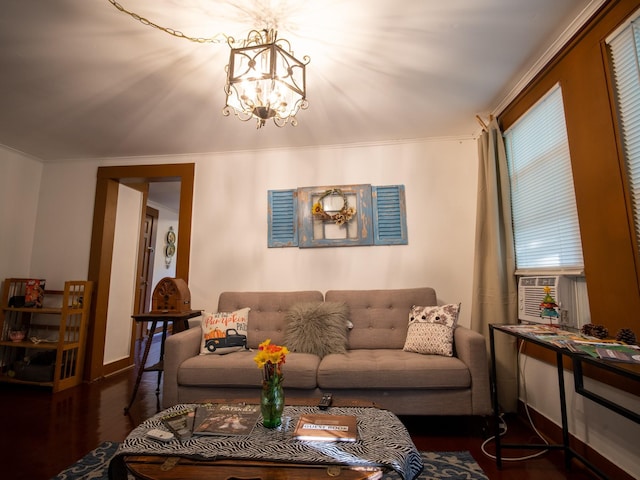 living room with dark hardwood / wood-style floors, cooling unit, and a notable chandelier