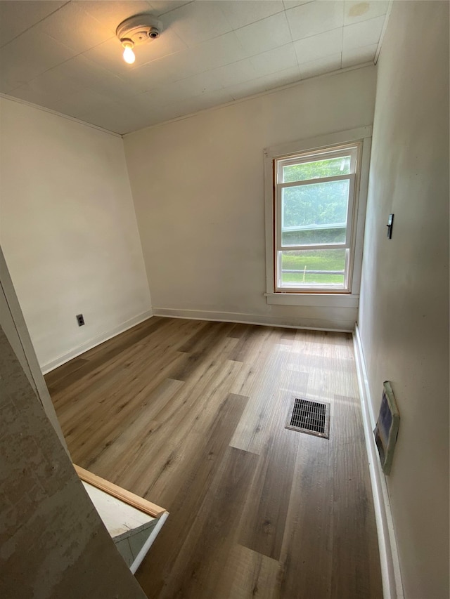 unfurnished room featuring hardwood / wood-style floors