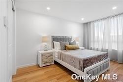 bedroom with light hardwood / wood-style floors