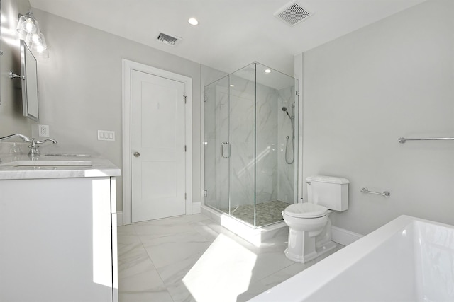 bathroom featuring vanity, toilet, and an enclosed shower