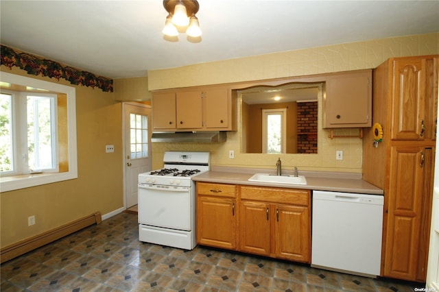 kitchen with backsplash, sink, white appliances, and a baseboard heating unit