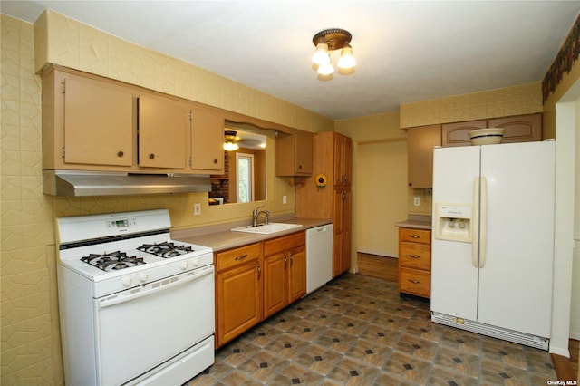 kitchen with white appliances, ceiling fan, and sink