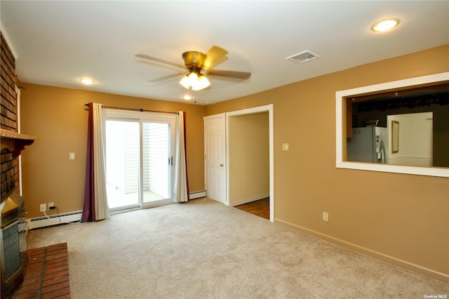 unfurnished living room featuring ceiling fan, a fireplace, light carpet, and a baseboard radiator